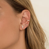 boucle d'oreille puce originale brillants rond blanc diamant barre traversant demi cercle demi rond dans l'oreille 